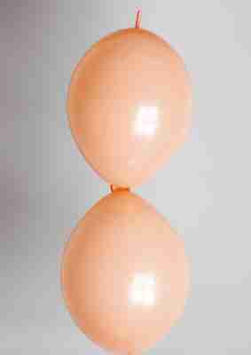 Doorknoopballon 25cm parel zalm